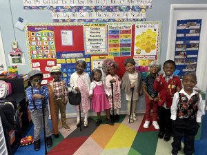 Children dressed as older related to number 100