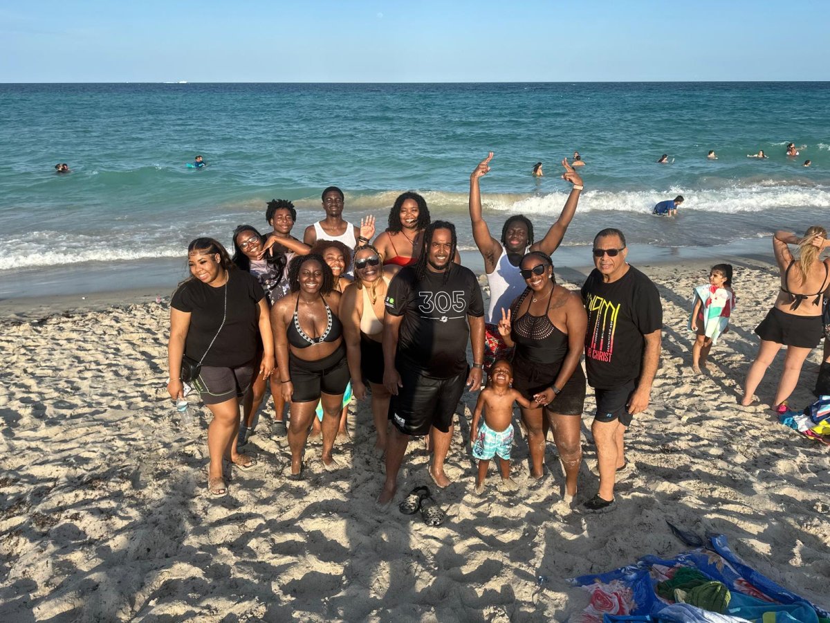 Photograph for story: Beach Fellowship With Praying Pelicans